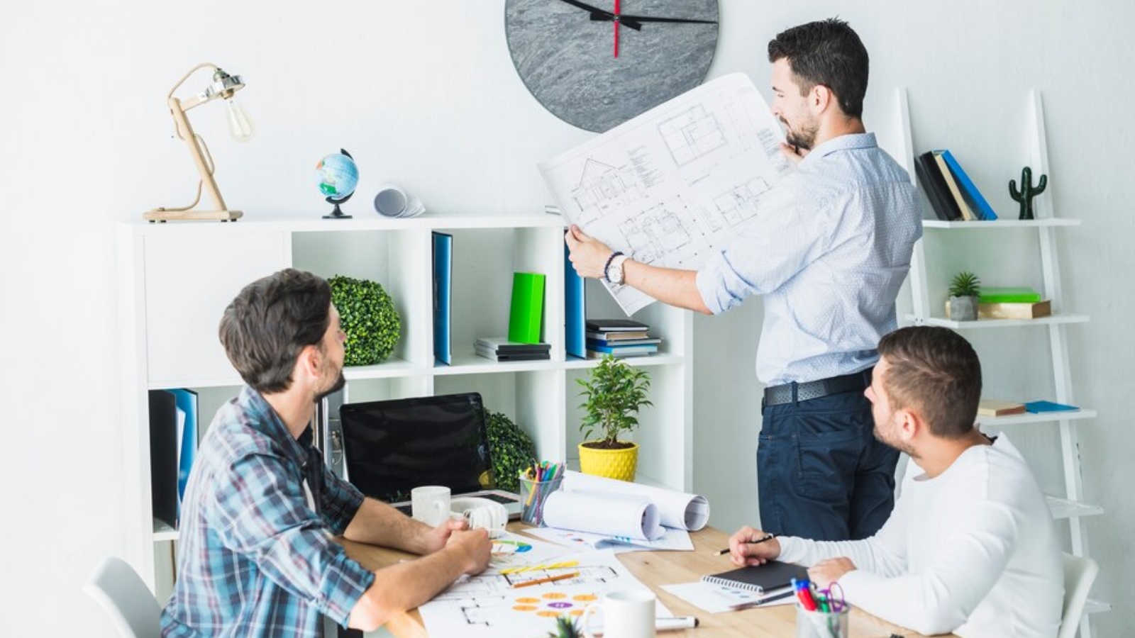 [fpdl.in]_architect-showing-blueprint-his-colleagues_23-2147839899_large