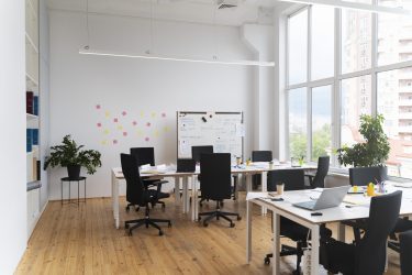 empty-room-with-chairs-desks-scaled